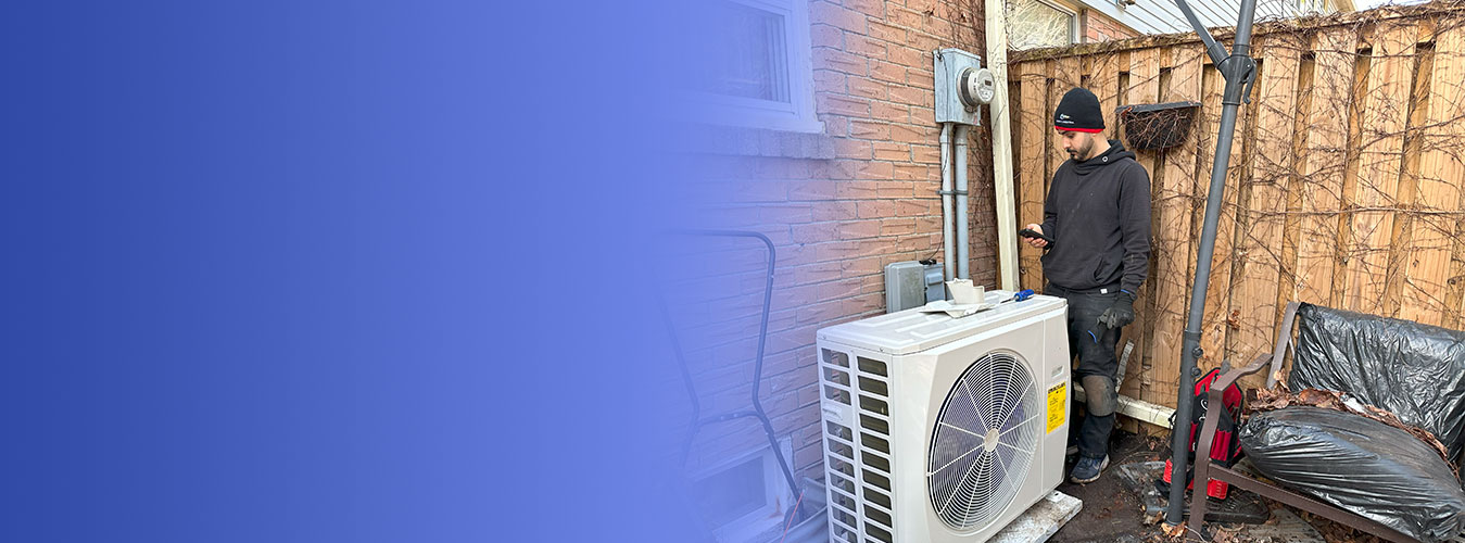 A technician carrying out a heat pump repair on an outdoor unit, the kind of visit a heat pump warranty claim starts with